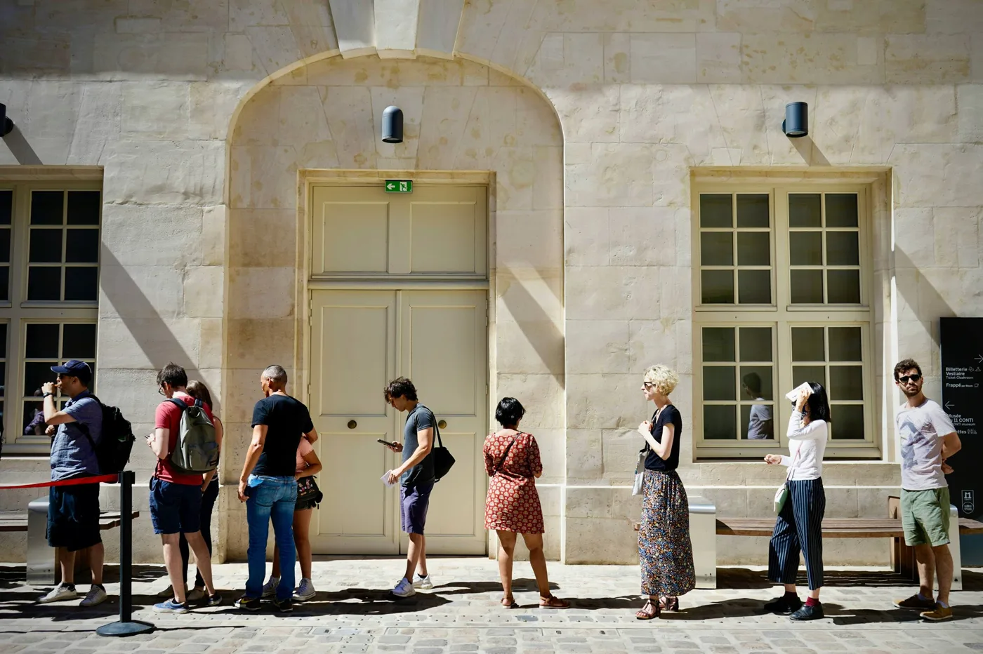 People standing outside a building in daylight